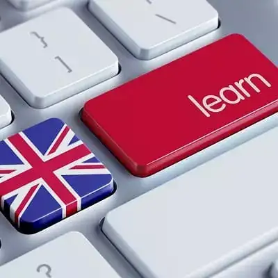 Tecla con la bandera del Reino Unido junto a una tecla roja con la palabra 'learn', representando el aprendizaje del inglés en línea